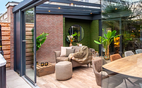 Glass sliding walls in canopy with glass roof – seamless outdoor space – Van Beem Buitenleven