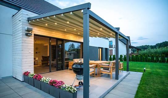 Tarasola Elegancy canopy with folding roof – sloping model against facade – Van Beem Outdoor Living