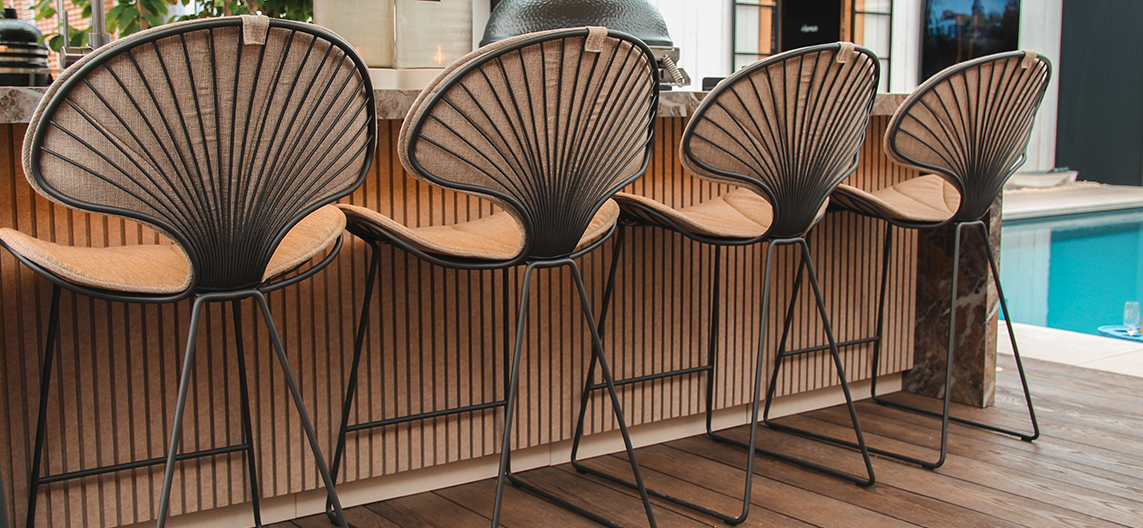 Back view of the Royal Botania Ostrea bar chair in bronze for a luxurious garden and patio