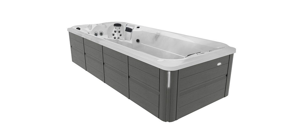 Jacuzzi J-19 PowerActive swim spa in Smoked Ebony for luxurious wellness and swimming in the garden